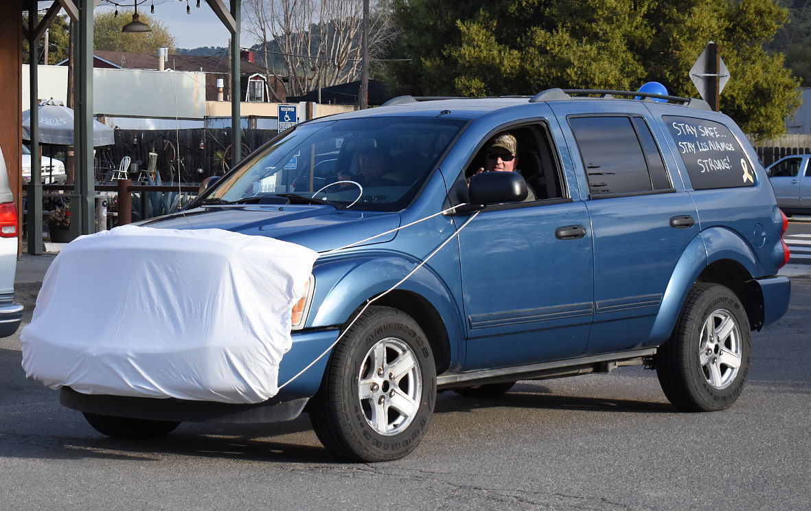 An SUV sports a safety mask during the Cruise Los Alamos parade Saturday evening.